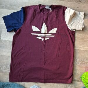 Adidas multi colored t shirt. Maroon shirt with one cream sleeve one navy blue